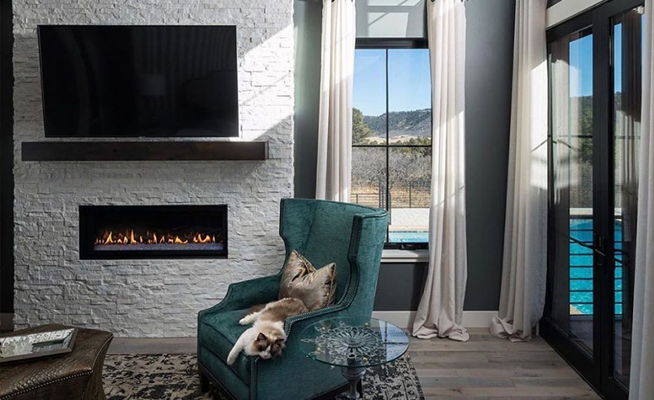 Cozy White Quartz Stacked Stone Fireplace in Living Room with Bright Blue Wall Color Design